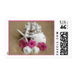 Seashells and Flowers on Sandy Beach postage