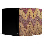 Section of embroidered fabric with gold plaques vinyl binder