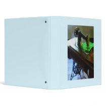 Sewing Machine With Green Cloth Vinyl Binders