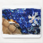 Sideneck Turtle eyeing a star on blue tinsel Mouse Pad