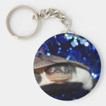 Sideneck turtle looking at viewer on blue tinsel keychains