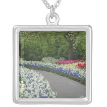 Sidewalk pathway through tulips and daffodils, pendants