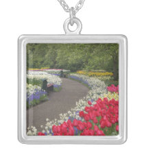 Sidewalk through tulips, daffodils, and jewelry