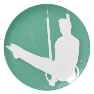 Silhouette of a man performing gymnastics party plate