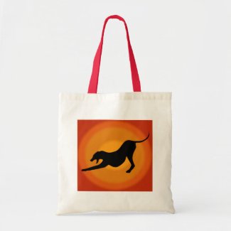 Silhouette of a Stretched Dog on Orange Background Canvas Bags