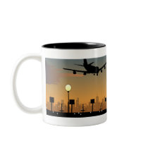 Silhouette of an airplane in flight coffee mug