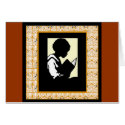 Silhouette of boy reading cards