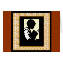 Silhouette of boy reading card