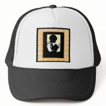 Silhouette of boy reading trucker hat