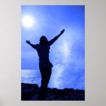 silhouette of lone woman facing a wave on cliff posters