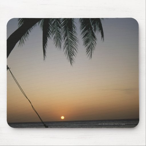 Silhuetted empty hammock at sunset mousepads