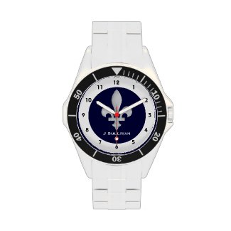 This classic stainless steel watch features a silver fleur-de-lis on a background of dark blue with black numbers on a circumference of white showing the time. Personalize with your name