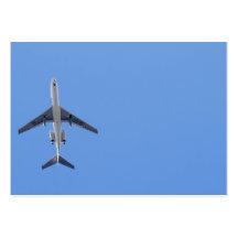 Single airplane on the blue sky background business cards