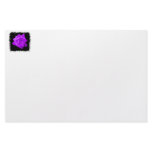 Single purple lilac rose against black jagged stationery paper
