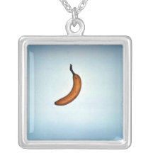 Single whole unpeeled banana jewelry