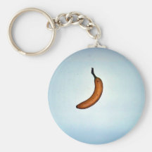 Single whole unpeeled banana keychain