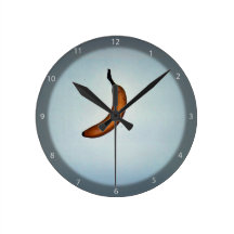 Single whole unpeeled banana wallclock