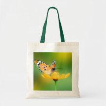 Sitting Pretty Little Butterfly on a Flower Tote Bags
