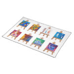 Six mini paintings on easels isolated on white placemat