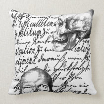 Skulls and script spell out "Liebesbrief" or Love pillows