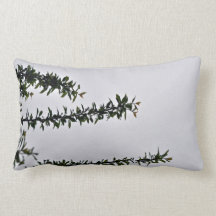 Small Green Leafy Branch against cloudy sky Throw Pillows