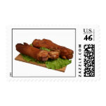 Smoked trotters on wooden board. postage