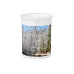 Snow covered landscape around the pond drink pitchers