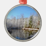 Snow covered landscape around the pond metal ornament