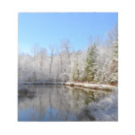 Snow covered landscape around the pond note pad