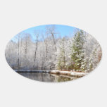 Snow covered landscape around the pond oval sticker