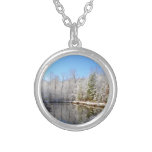 Snow covered landscape around the pond round pendant necklace