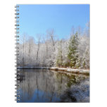 Snow covered landscape around the pond spiral notebook