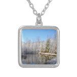Snow covered landscape around the pond square pendant necklace