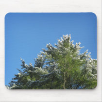 Snow-tipped Pine Tree on Blue Sky mousepads