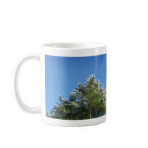 Snow-tipped Pine Tree on Blue Sky mugs