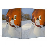 Snowman in front of red barn in Columbia Falls binders
