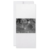 Solarized negative photograph of solo figure rack cards