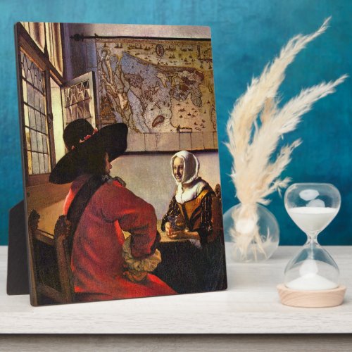 Soldier and girl smiling by Johannes Vermeer Plaques