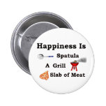 spatula grill and a slab of meat pins