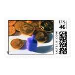 Spinning Dreidel with Gelt (chocolate coins)