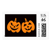 Spooky and happy Halloween Jack o lantern on black Postage Stamps