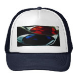 Spoons with blue and red liquid hats