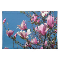 spring pink magnolia flowers in blue sky placemat