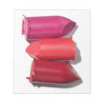 Stack of broken lipstick memo pad