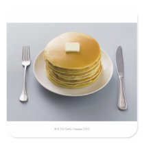 Stack of pancakes with butter on a plate stickers