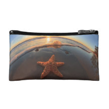 Starfish on Beach at Sunset Cosmetics Bags