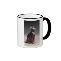 Statuette of a cat with gold earrings coffee mug