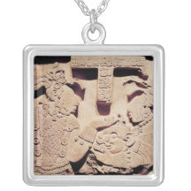 Stela depicting a woman presenting a jaguar mask necklaces