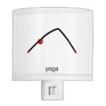 Stick figure of downward dog pose with yoga text. nite light