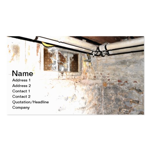 stone walls and piping in an old basement business card